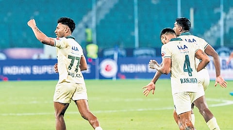 Odisha FC players celebrate a goal against Chennaiyin FC.