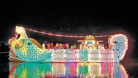 Swan-shaped float decked with lights carries idols of deities during Teppotsavam on Godavari river in Bhadrachalam on Thursday