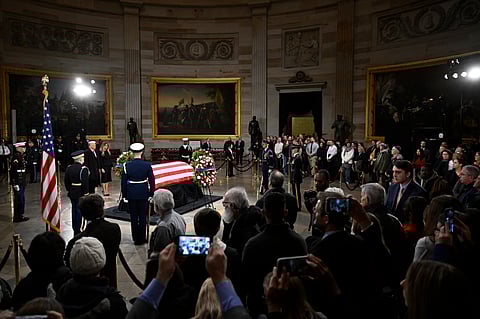 President elect Donald Trump and his wife Melania Trump visit the flag draped casket of the late former President Jimmy Carter as he lies in state at the Rotunda of the U.S. Capitol on Wednesday,