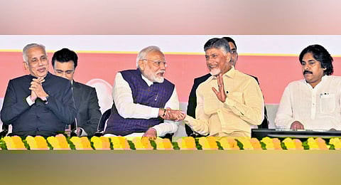 Governor S Abdul Nazeer, Prime Minister Narendra Modi, Chief Minister N Chandrababu Naidu and Deputy Chief Minister Pawan Kalyan attend a public meeting in Visakhapatnam on Wednesday