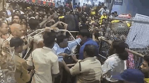 Police personnel try to control the crowd as hundreds of devotees jostle for tickets for Vaikunta Dwara Darshanam when a stampede broke out at Lord Venkateswara Swamy temple on Tirumala Hills, in Tirupati, Andhra Pradesh, Wednesday, Jan. 8, 2025.