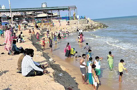 Devotees taking a bath at the Tiruchendur temple beach on Thursday 