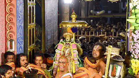 Lord Namperumal being carried through the ‘paramapada vaasal’ at the Ranganathaswamy temple in Srirangam early on Friday 