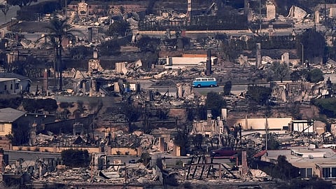A VW van sits among burned out homes in Malibu.