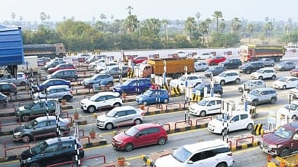 Hundreds of vehicles seen waiting to cross the Panthangi toll plaza on NH-65 on Saturday