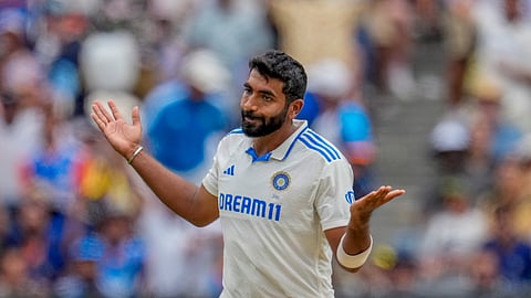 India's Jasprit Bumrah celebrates the wicket of Travis Head during the fourth cricket test between Australia and India at the Melbourne Cricket Ground, Melbourne, Australia, Thursday, Dec. 26, 2024.
