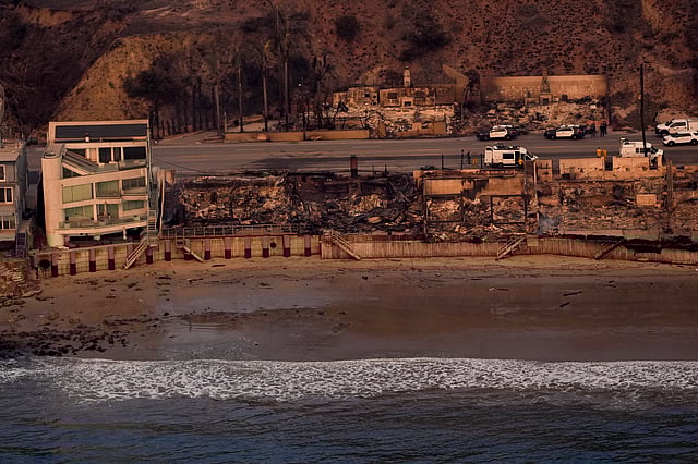 Beach front properties are left destroyed by the Palisades Fire, as some remain standing at left, Jan. 9, 2025 in Malibu, Calif.