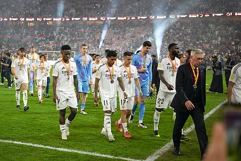 Real Madrid players leave the pitch after the final soccer match between Real Madrid and Barcelona at King Abdullah Stadium in Jeddah
