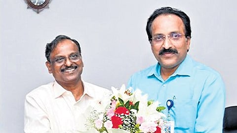 Outgoing ISRO Chairman Dr S Somanath (right) greets new Chairman Dr V Narayanan in Bengaluru on Tuesday 