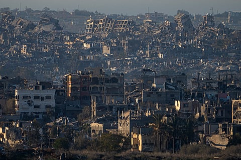 Destroyed buildings are seen inside the Gaza Strip from southern Israel on Monday.