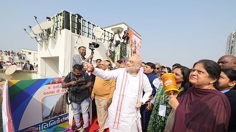 Union Home Minister Amit Shah flies a kite during 'Makar Sankranti' festival celebrations, in Ahmedabad with his wife and Gujarat CM Bhupendra Patel.