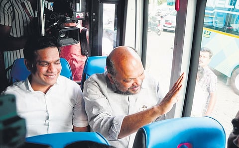 Industries Minister P Rajeeve and MP Hibi Eden travelling in a ‘Metro Connect’ bus after lauching e-feeder bus service at Kalamassery on Wednesday 