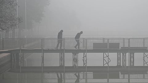 A thick layer of fog envelops Delhi-NCR as cold wave continues,in New Delhi.