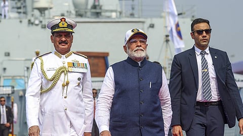Prime Minister Narendra Modi with Chief of the Naval Staff Admiral Dinesh K. Tripathi during the commissioning ceremony of three Indian Navy warships INS Surat, INS Nilgiri and INS Vaghsheer, at the Naval Dockyard in Mumbai.