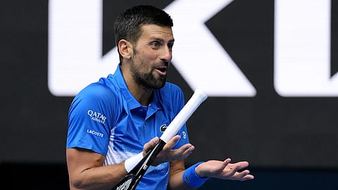 Novak Djokovic of Serbia reacts during his second round match against Jaime Faria of Portugal at the Australian Open tennis championship in Melbourne, Australia, Wednesday Jan 15, 2025.