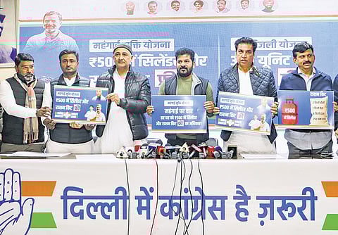 Chief Minister A Revanth Reddy, along with AICC Delhi in-charge Qazi Nizamuddin, Delhi Congress President Devender Yadav and other leaders, unveils the Congress’ promises during a press conference in New Delhi 