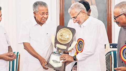 CM Pinarayi Vijayan presenting the Ezhuthachan Award to writer N S Madhavan at the Secretariat Durbar Hall in Thiruvananthapuram on Thursday. Minister Saji Cherian, Kerala Sahitya Academy secretary C P Aboobacker are also seen.