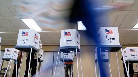 People vote during the US presidential elections, Nov. 5, 2024, in Oak Creek, Wis.