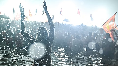 Naga Sadhus take a dip in Sangam, the confluence of the Ganges, Yamuna and mythical Saraswati rivers, during Shahi Snan, or 'royal bath', to mark the Maha Kumbh Mela festival, in Prayagraj on January 14, 2025.