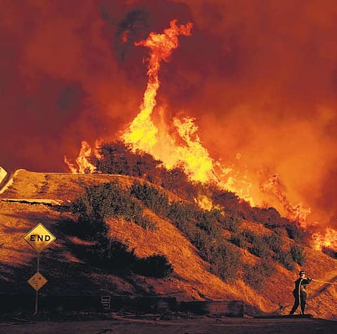 File photo of a firefighter battling the Palisades fire in Los Angeles last week 