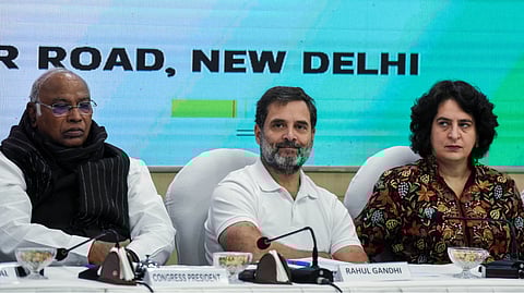(L-R) AICC President Mallikarjun Kharge and Congress leaders Rahul Gandhi and Priyanka Gandhi Vadra address a press conference at the party headquarters in Delhi.