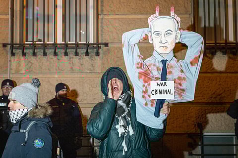 Demonstrators hold portraits of hostages held by Hamas in the Gaza Strip during a protest calling for their immediate release in Tel Aviv, Israel, Saturday Jan. 18