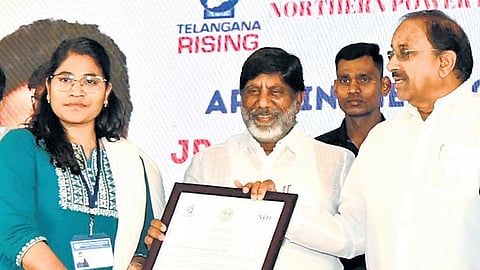 Deputy Chief Minister Mallu Bhatti Vikramarka hands over an apppoinment letter to a newly recruited candidate in TGNPDCL in Hyderabad on Saturday