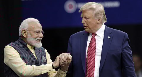 In this photo from Sept. 22, 2019, Prime Minister Narendra Modi and President Donald Trump shake hands after introductions during the "Howdi Modi" event in Houston.