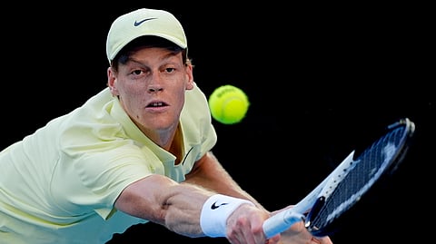 Jannik Sinner of Italy plays a backhand return to Marcos Giron of the U.S. during their third round match at the Australian Open.