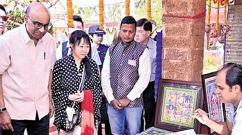 President Tharman and First Lady watch an artist at work in Raghurajpur village 
