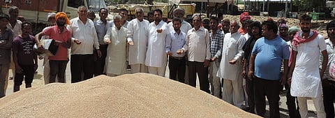 Farmers with their harvest.