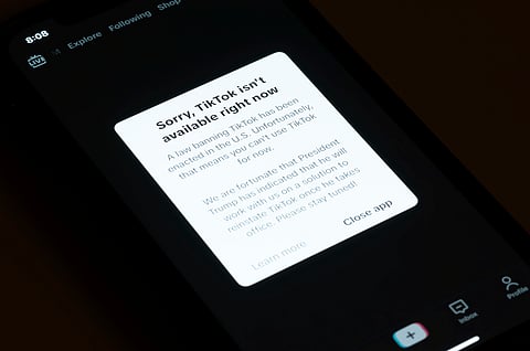 A message reading "Sorry, TikTok isn't available right now" is displayed from the TikTok app on a cell phone screen on Saturday, Jan. 18, 2025, in Los Angeles. 