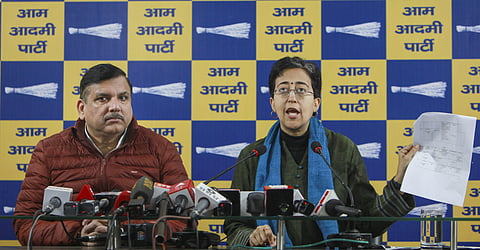 Delhi Chief Minister and AAP leader Atishi with party leader Sanjay Singh addresses a press conference, in New Delhi, Sunday