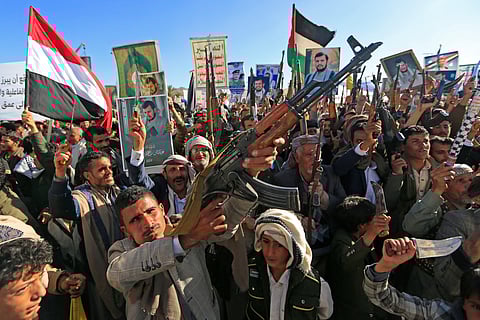 Demonstrators hold portraits of hostages held by Hamas in the Gaza Strip during a protest calling for their immediate release in Tel Aviv, Israel, Saturday Jan. 18