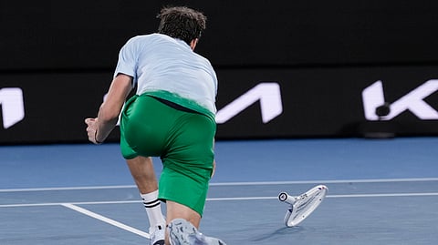 Daniil Medvedev of Russia throws his racker during his second round match against Learner Tien of the U.S. at the Australian Open tennis championship in Melbourne, Australia, Thursday, Jan. 16, 2025.