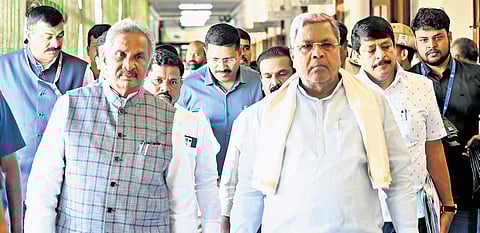 Chief Minister  Siddaramaiah arrives for a meeting,  along with Energy Minister 
KJ George, at Vidhana Soudha on Monday 