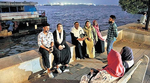 Lakshadweep natives who arrived in Kochi for treatment sitting near the Ernakulam boat terminal on Monday