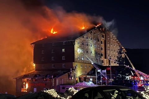 Firefighters work to extinguish a fire in a hotel at a ski resort of Kartalkaya in Bolu province, in northwest Turkey, Tuesday, Jan 21, 2025.