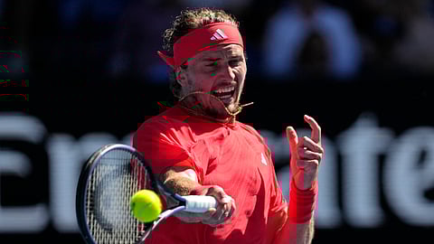 Alexander Zverev of Germany plays a forehand return to Tommy Paul of the U.S. during their quarterfinal match at the Australian Open tennis championship.
