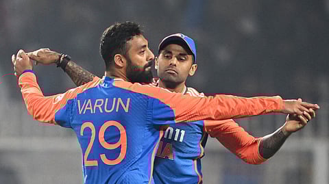 Varun Chakravarthy celebrates a wicket with captain Suryakumar Yadav on Wednesday