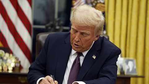 President Donald Trump signs executive orders in the Oval Office of the White House, Monday, Jan. 20, 2025, in Washington.