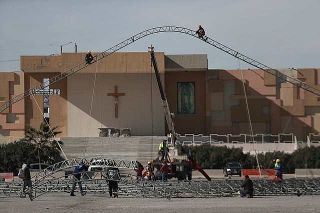 Workers begin the installation of a temporary shelter for possible deportees from the United States, in Ciudad Juarez, Mexico, Wednesday.