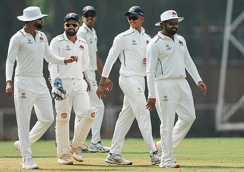 Mumbai's Rohit Sharma and Co celebrate a wicket against J&K on Thursday