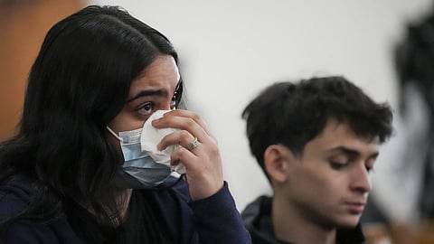 Leila Vega wipes tears during a vigil for students that were killed and injured in a school shooting, Wednesday, Jan 22, 2025, in Nashville, Tenn. 