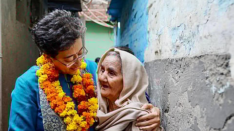 Atishi meets a supporter during her ‘padyatra’ on Thursday  