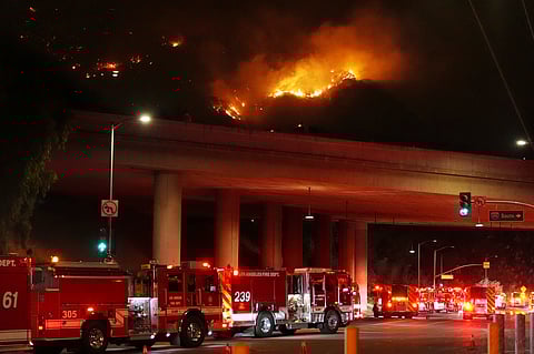 A firefighter battles the Palisades Fire as it burns a structure in the Pacific Palisades neighbourhood of Los Angeles, Jan. 7, 2025.