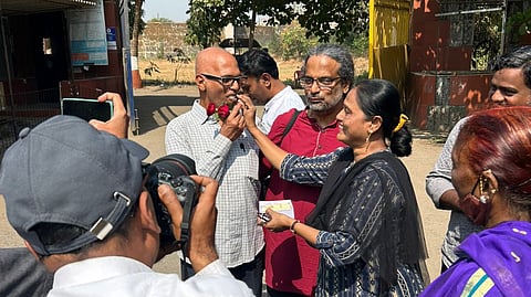 Researcher Rona Wilson (R) and activist Sudhir Dhawale (L) greeted upon being released from the Taloja Jail in Navi Mumbai on Friday, Jan. 24, 2025.