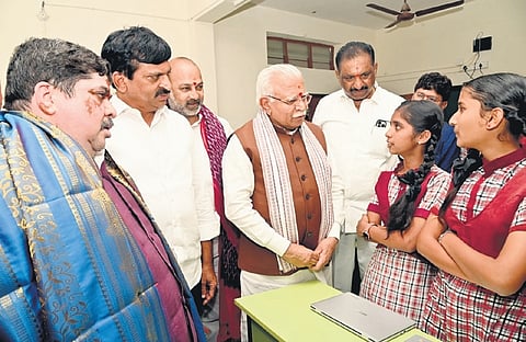 Union Minister of Housing and Urban Affairs Manohar Lal Khattar interacts with students after inaugurating digital smart classes in Karimnagar on Friday