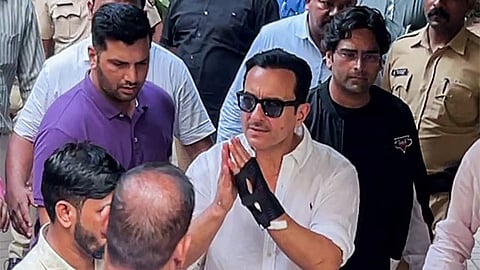 Actor Saif Ali Khan greets as he arrives at his residence after getting discharged from Lilavati Hospital, in Mumbai 