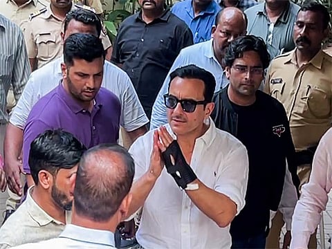 Actor Saif Ali Khan greets as he arrives at his residence after getting discharged from Lilavati Hospital, in Mumbai 